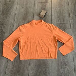 Nike woman’s yoga tight fit crop with long sleeve